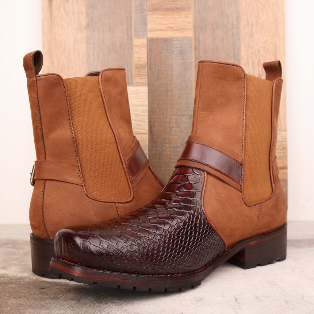 Premium handcrafted brown leather ankle boots with a classic leather sole for durability and a refined finish. Featuring sleek buckle detailing on the ankle, these boots are perfect for both formal and casual occasions, offering comfort and timeless style.