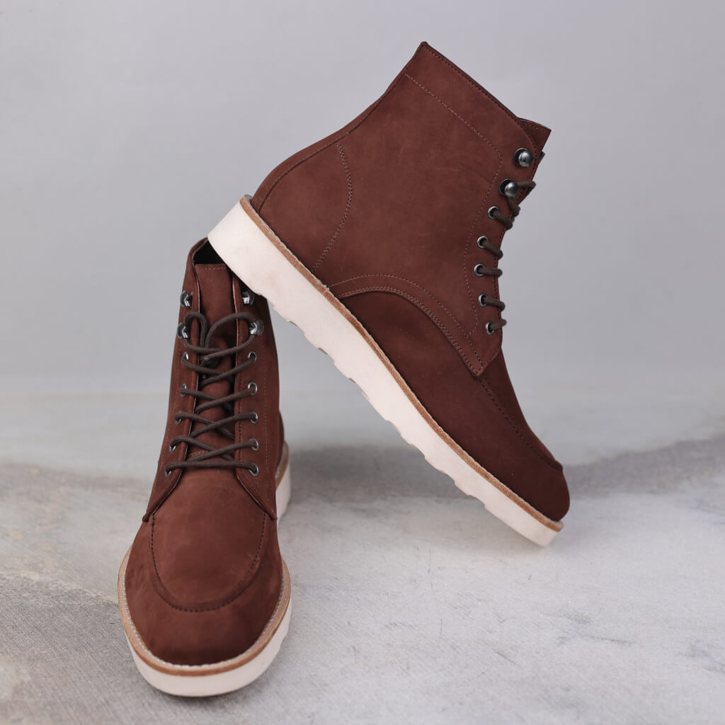 A pair of Heritage Ember Nubuck Rusty Boots crafted from premium nubuck leather, featuring a rich, rustic finish. Equipped with a Doctor Sole for superior cushioning and support, these boots offer comfort, durability, and timeless style for both outdoor and urban wear.