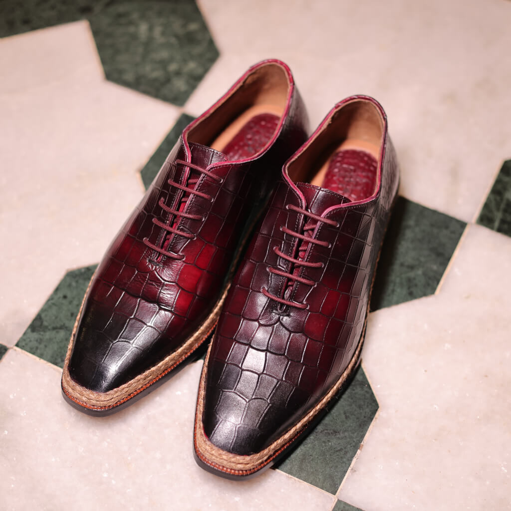 Nordic Lace lace-up shoes made from wine-colored croco-embossed leather and hand-painted premium Crust Argentina leather. Featuring a fine Italian leather sole, these shoes offer durability, luxury, and a sophisticated edge, perfect for elevating any outfit.