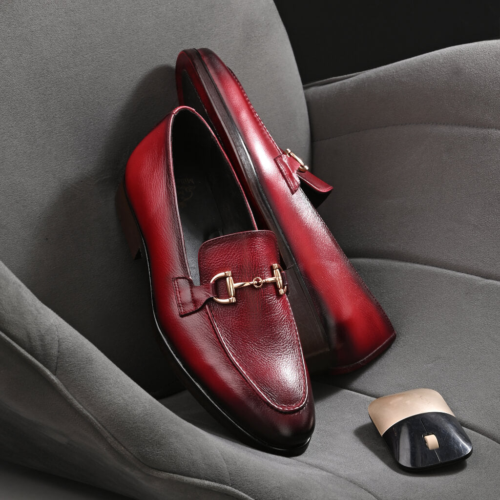 "Luxora Leather Loafers by Mille Dollari—hand-painted burgundy gradient leather with a gold horsebit detail, offering luxury, elegance, and effortless slip-on comfort."