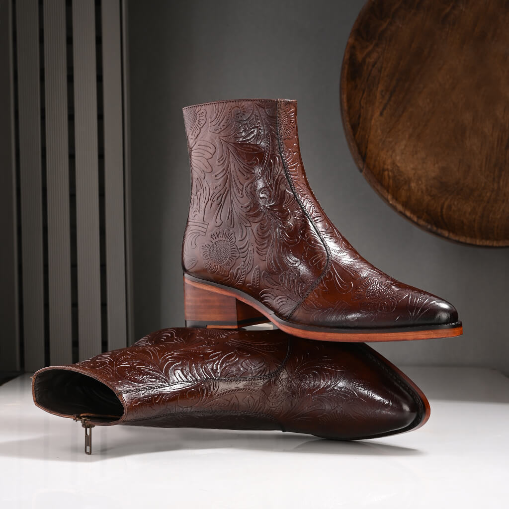 "Majestic Embossed Italian Leather Boots by Mille Dollari – handcrafted dark brown leather boots with intricate floral embossing, featuring a robust Italian leather sole for a refined, luxurious look."