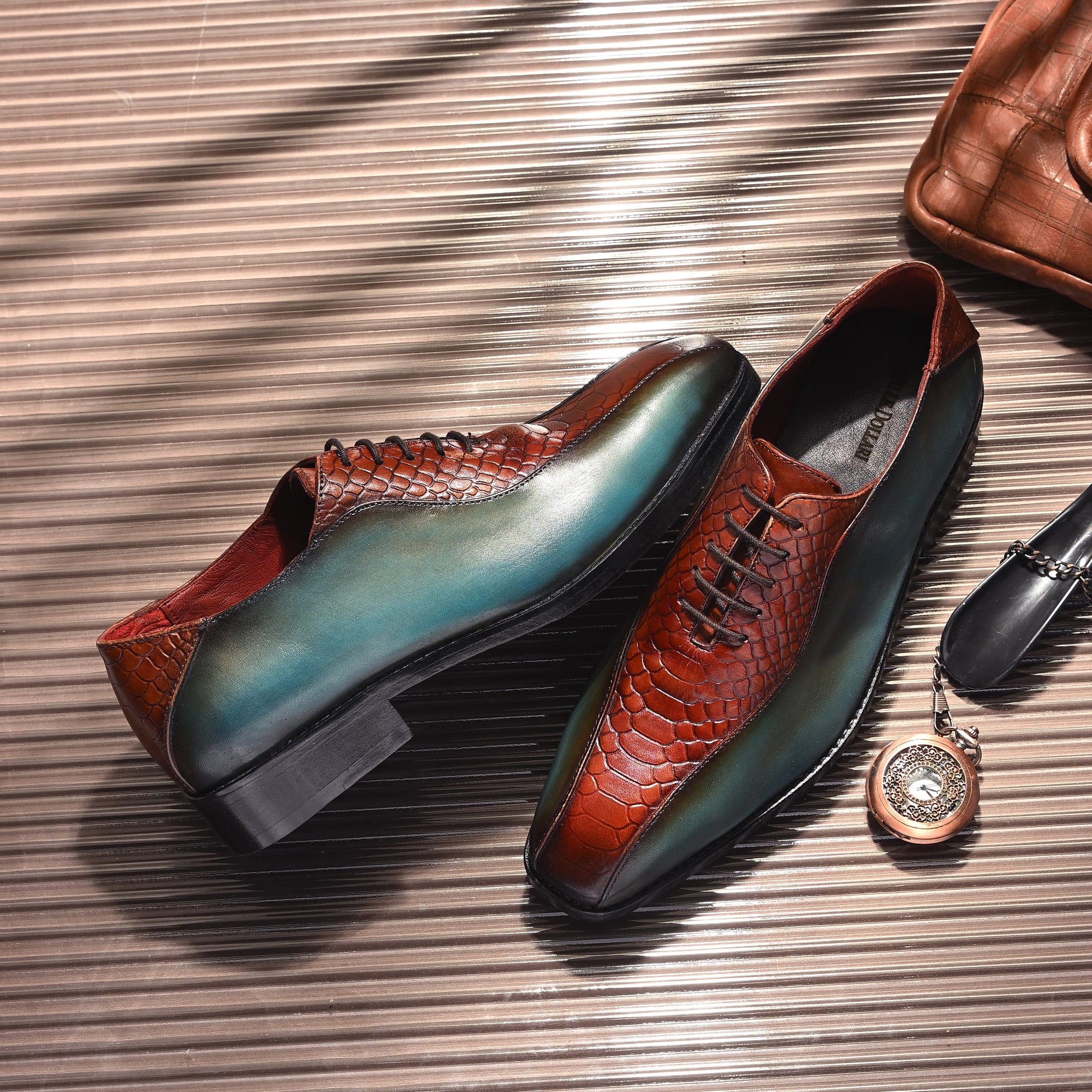 Handcrafted teal patina and brown python-embossed leather men’s Oxford dress shoes with lace-up design