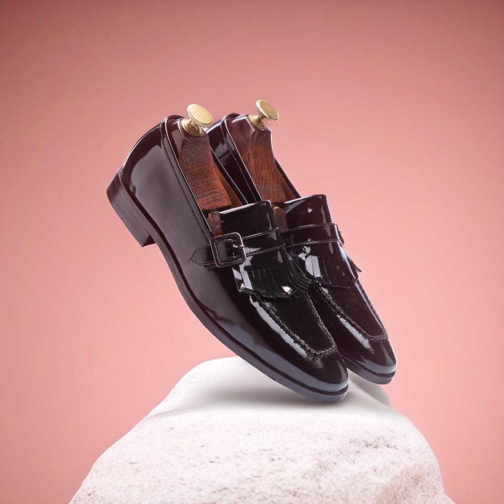 The Marco Patent Kiltie Monkstrap in Black – a sleek single monkstrap shoe by Mille Dollari with a patent leather finish, leather sole, and anti-slip TPR grip.