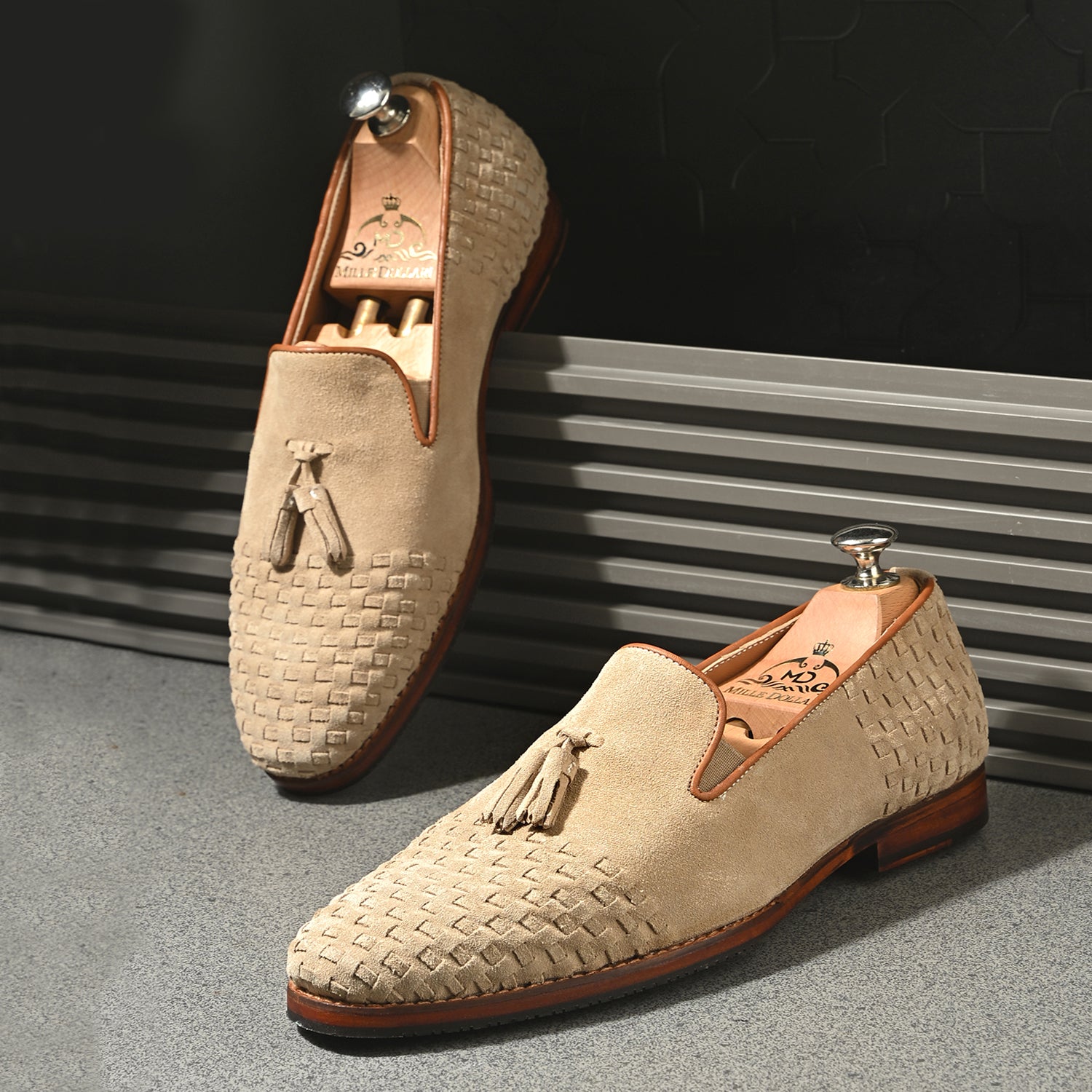 Beige suede men’s woven penny loafers with handcrafted leather sole.
