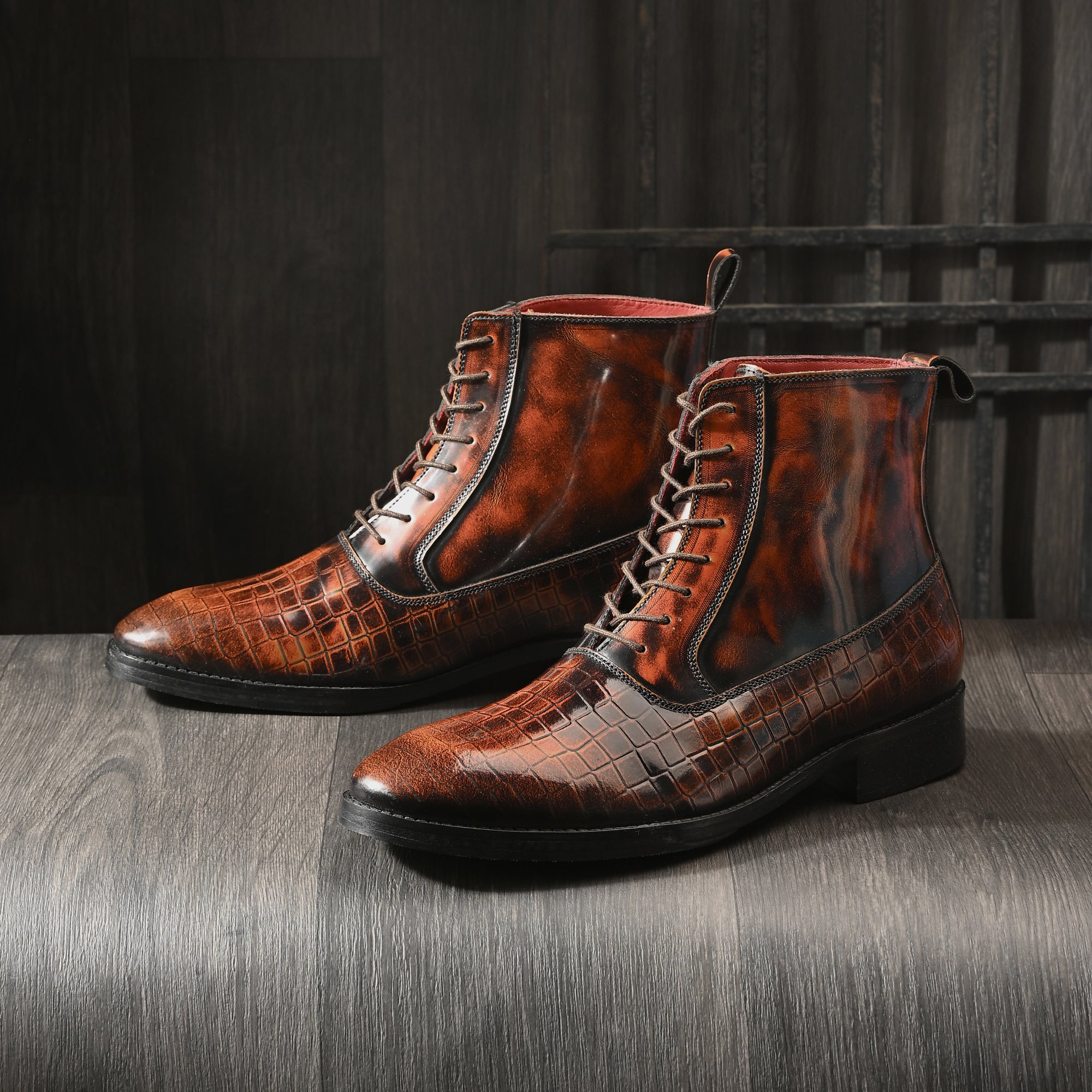 Men’s textured brown leather lace-up boots with pointed toe and polished finish