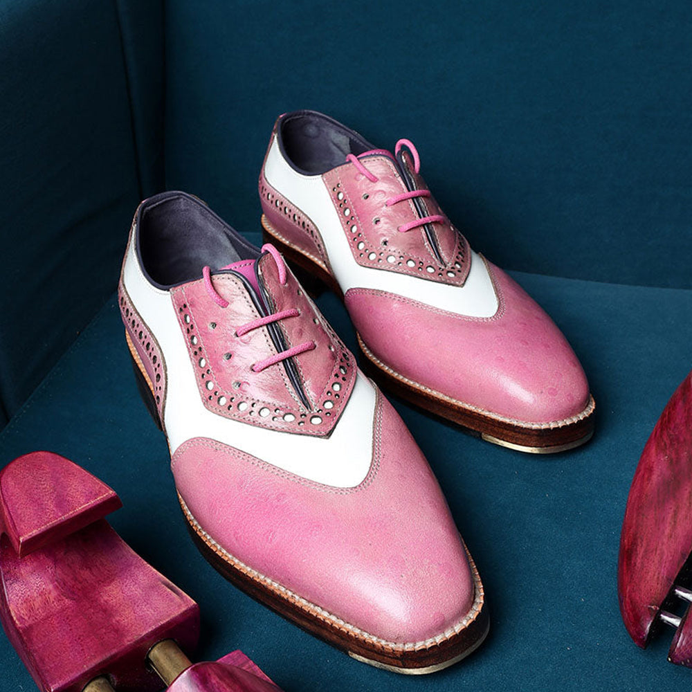 Men’s pink and white two-tone leather brogue oxford shoes with lace-up closure and wingtip perforated design