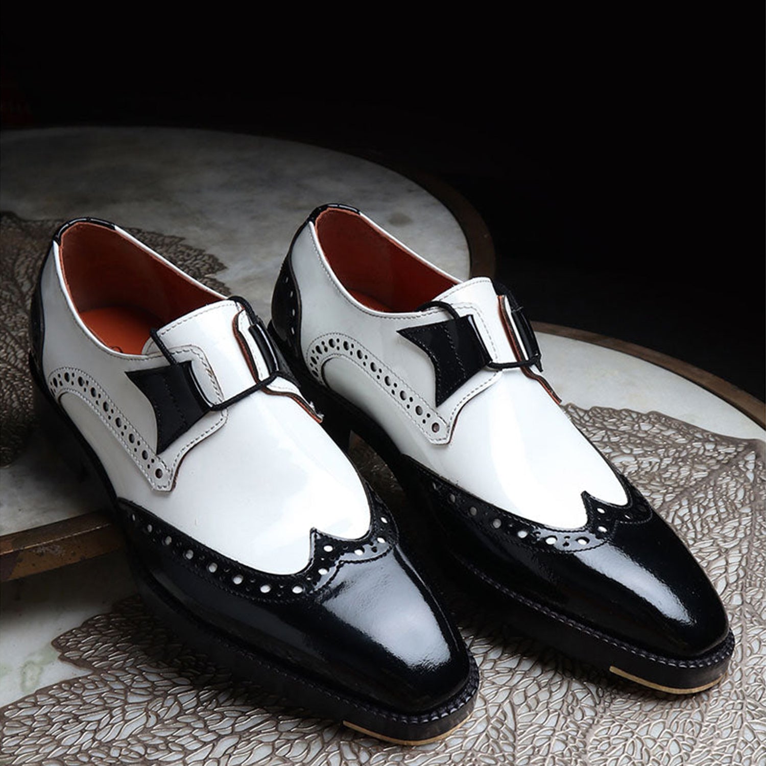 Men’s black and white leather monk strap shoes with two-tone brogue detailing, premium formal dress shoes for office and business wear