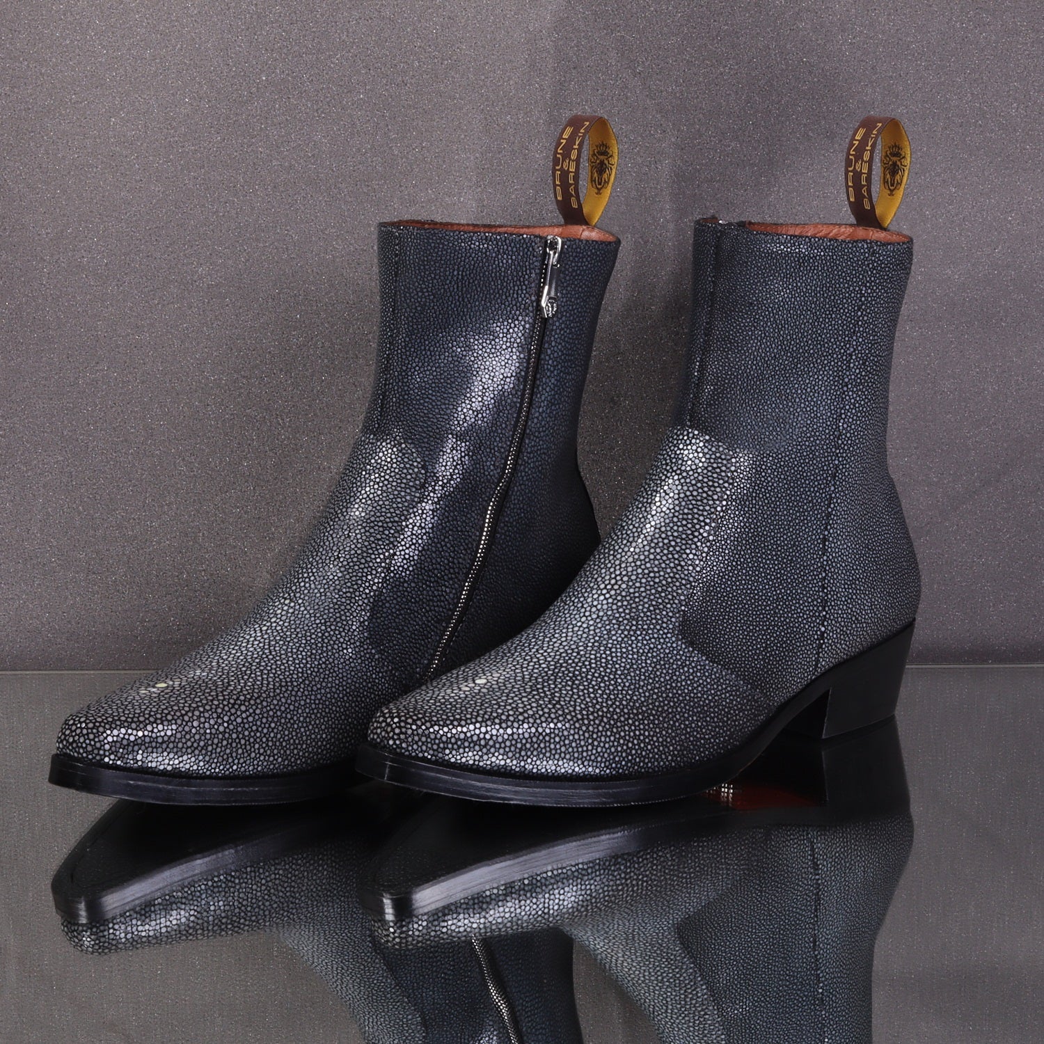 Men’s black textured leather ankle boots with stingray-style finish and side zipper, luxury formal leather boots for men