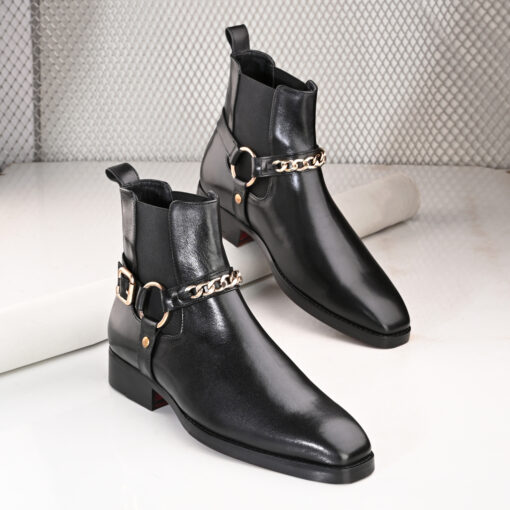 Regent Black Chain Chelsea Boots by Mille Dollari featuring premium leather, gold chain detailing, and a sleek design perfect for a luxurious statement look